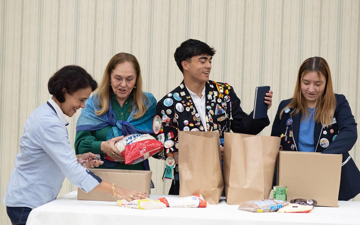  George French and Regina Alesi participate in a Rotary meeting last year during their exchanges in Brazil. 