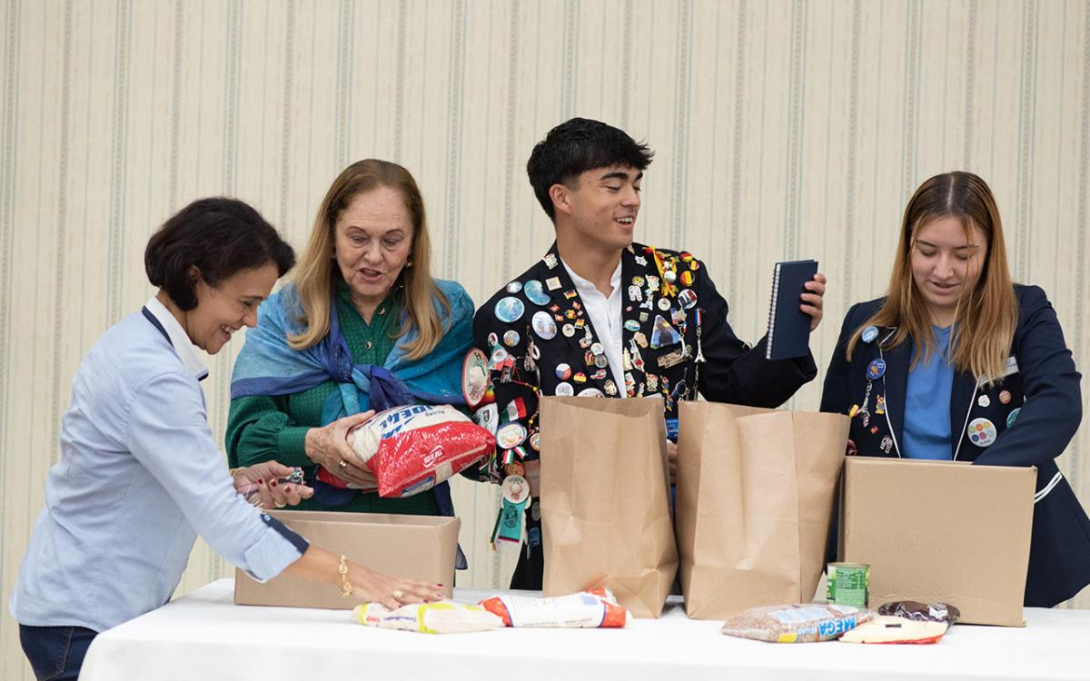  George French and Regina Alesi participate in a Rotary meeting last year during their exchanges in Brazil. 